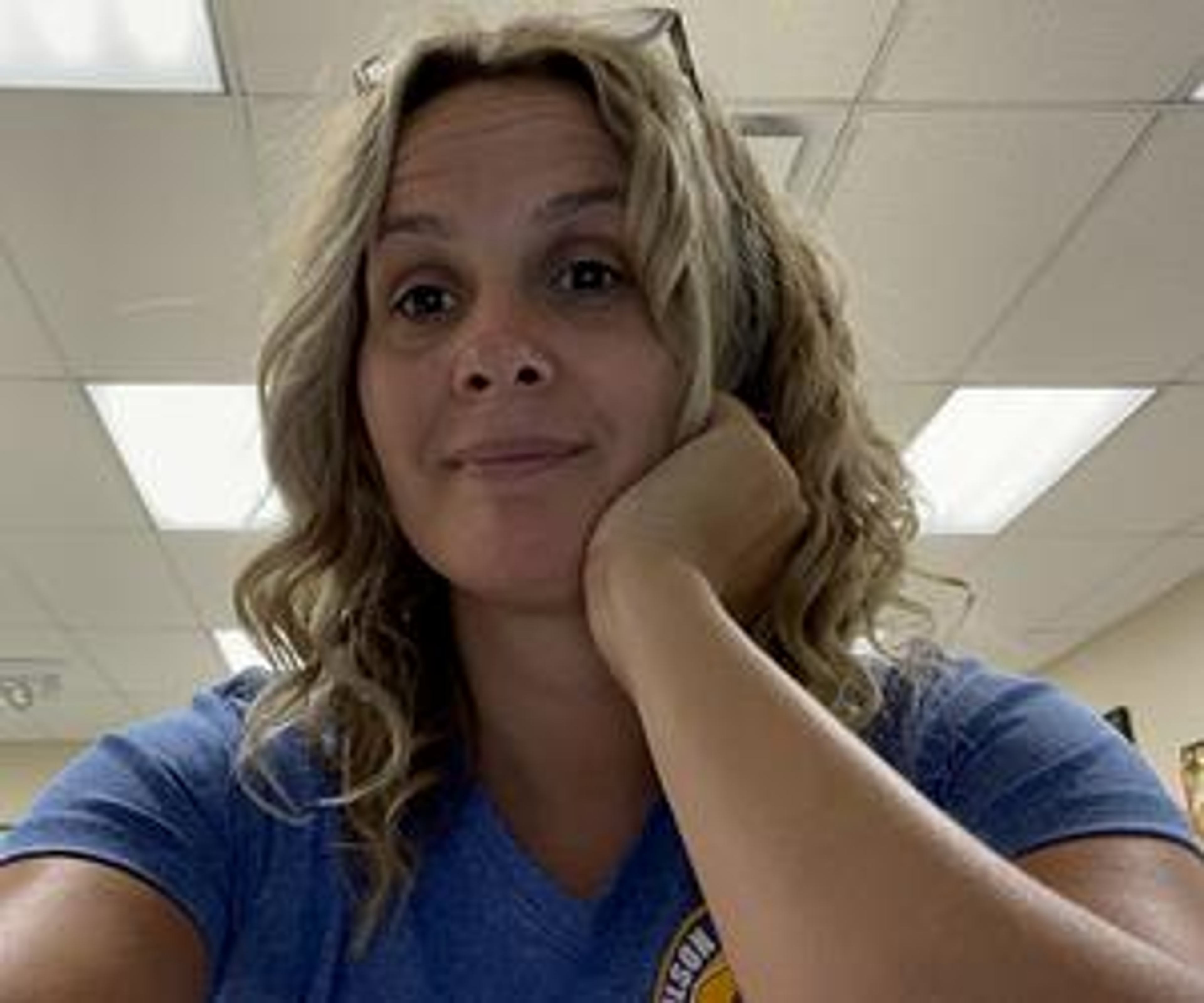 Jenna Purdue, a Classroom Champions team member, taking a selfie in a classroom.