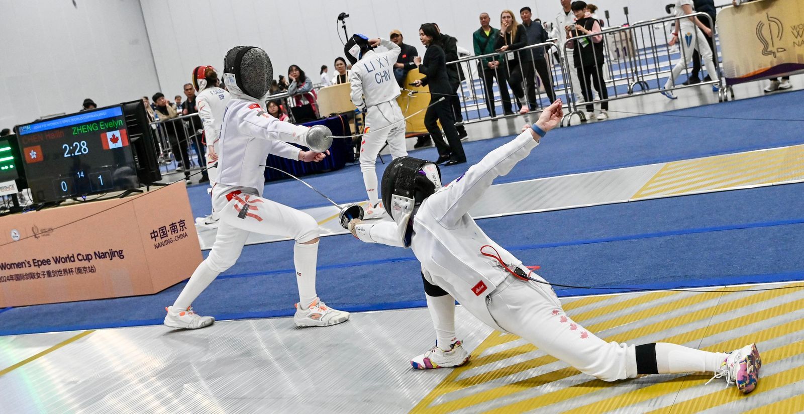 Evelyn Zheng competing in Fencing