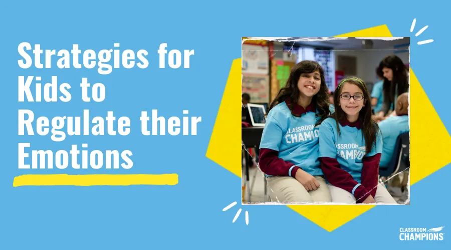 Two students in Classroom Champions shirts smile together in their classroom.