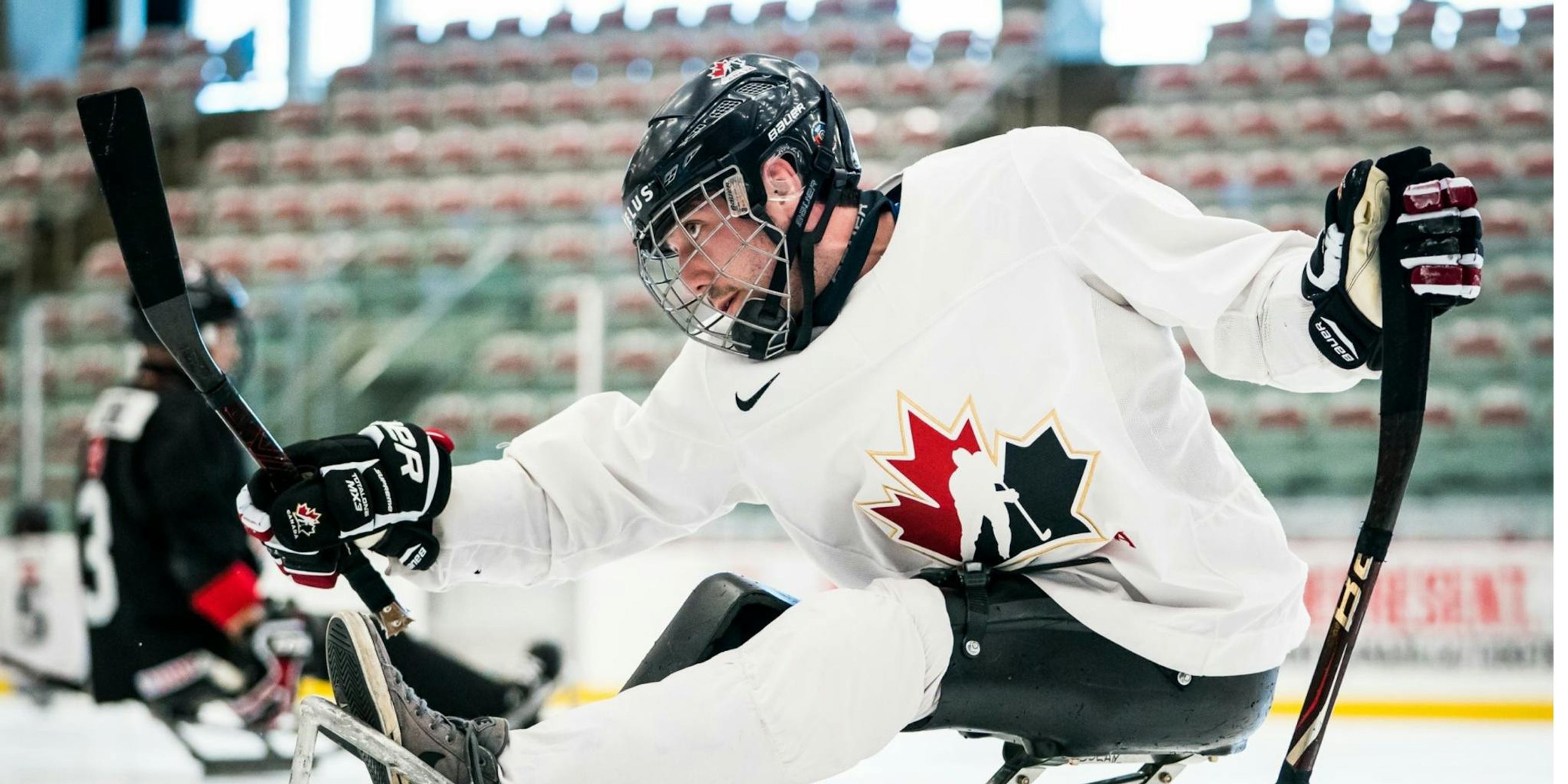 Cody Dolan competing in Sled Hockey