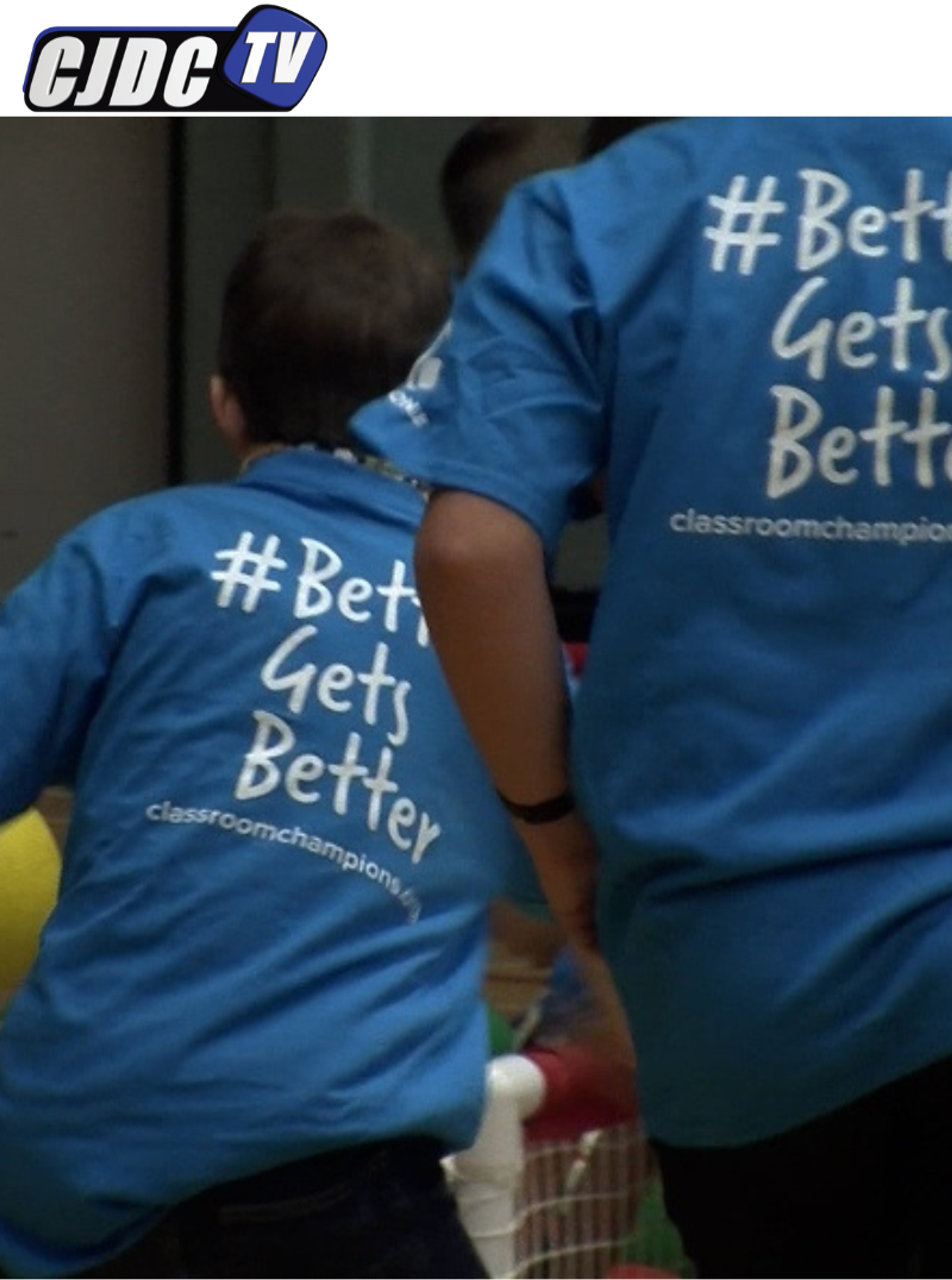 Students wear blue Classroom Champions shirts reading "#BetterGetsBetter, classroomchampions.org".