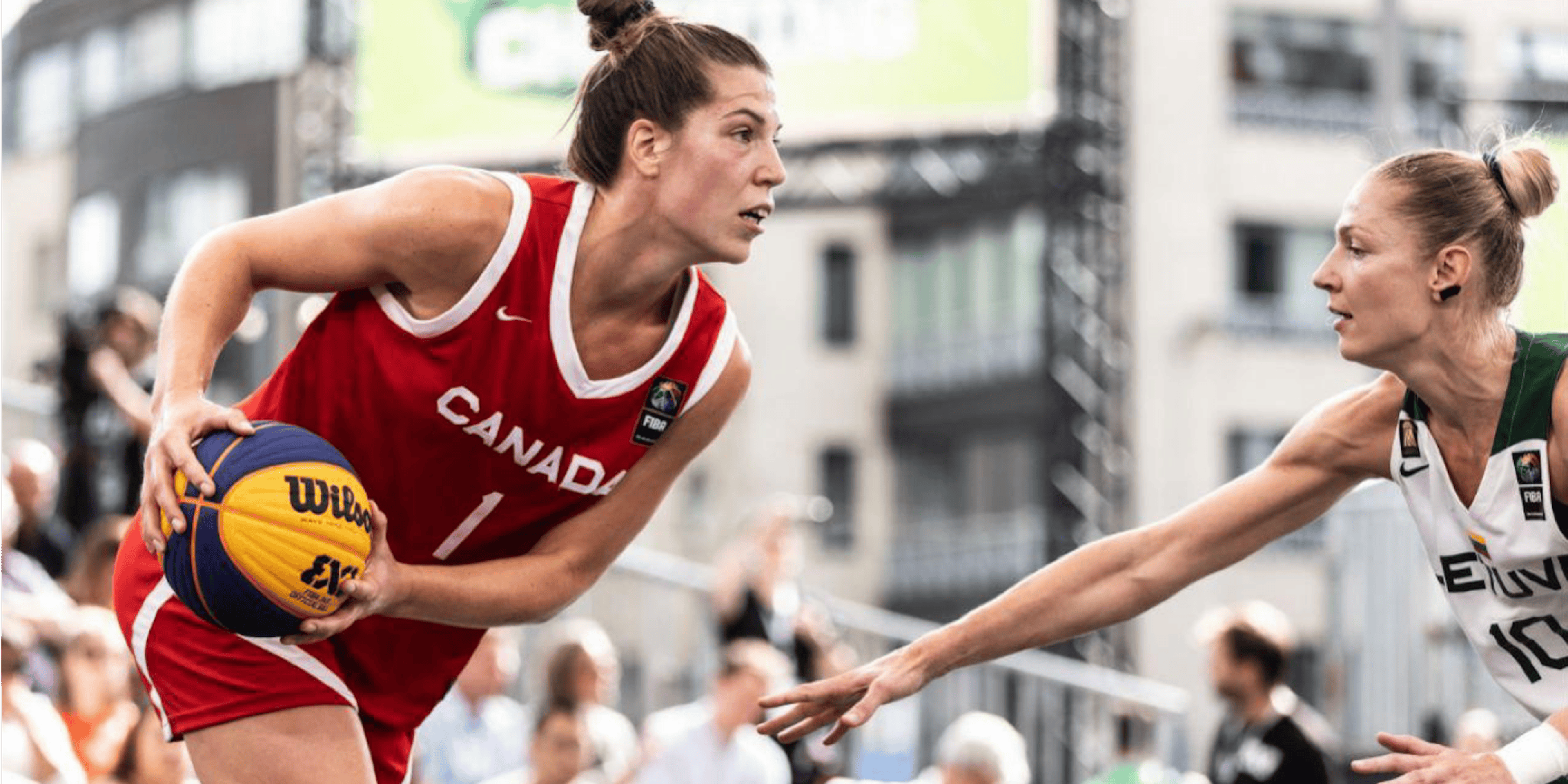 Michelle Plouffe competing in Basketball