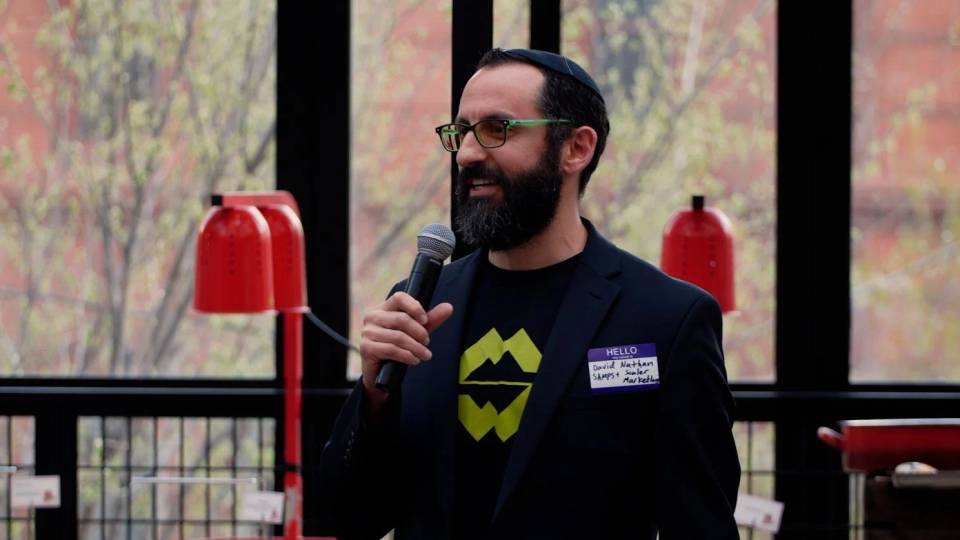 David Nathan speaking at an event