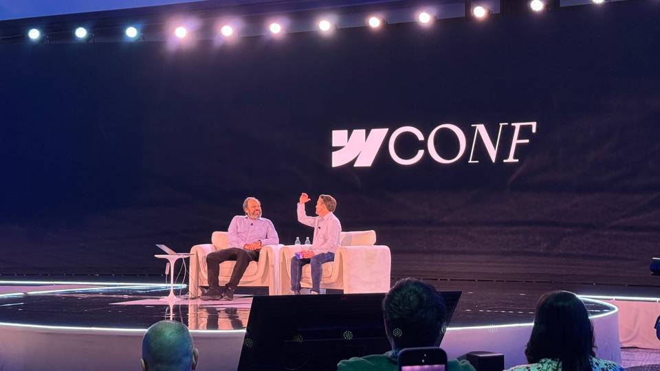 Ethan Mollick speaking with Dave Steer during a fireside chat at Webflow Conf 2026 about how AI agents are changing the way teams work.