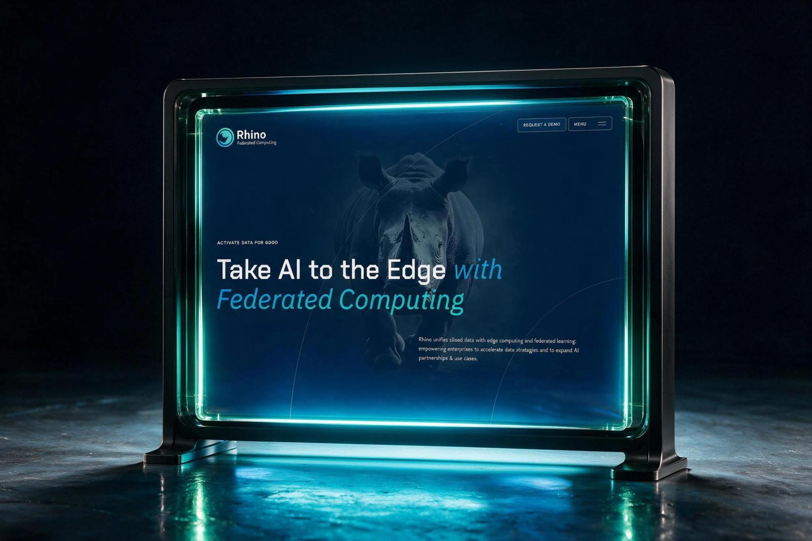 Glowing glass display panel showing a client website in a dark studio, with cyan edge light