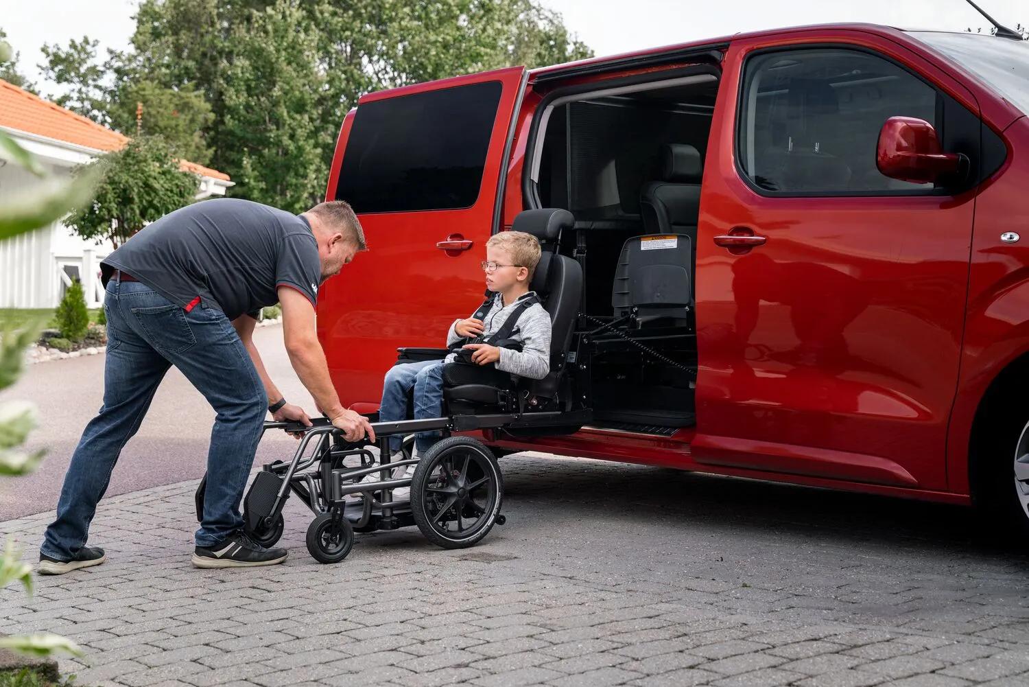 Red van with Carony wheelchair transfer system