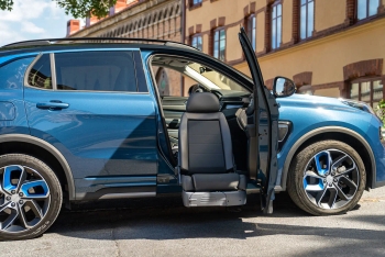Blue SUV with Turny Evo rotating and lowering passenger seat extended outward