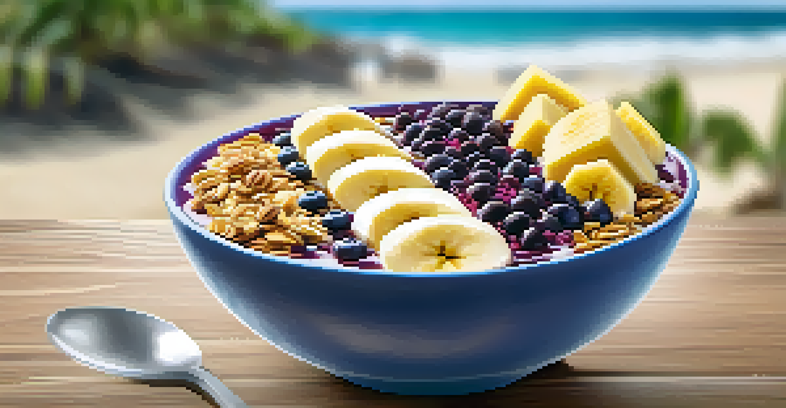 A colorful açaí smoothie bowl topped with granola and bananas, displayed on a beachside table with ocean views.