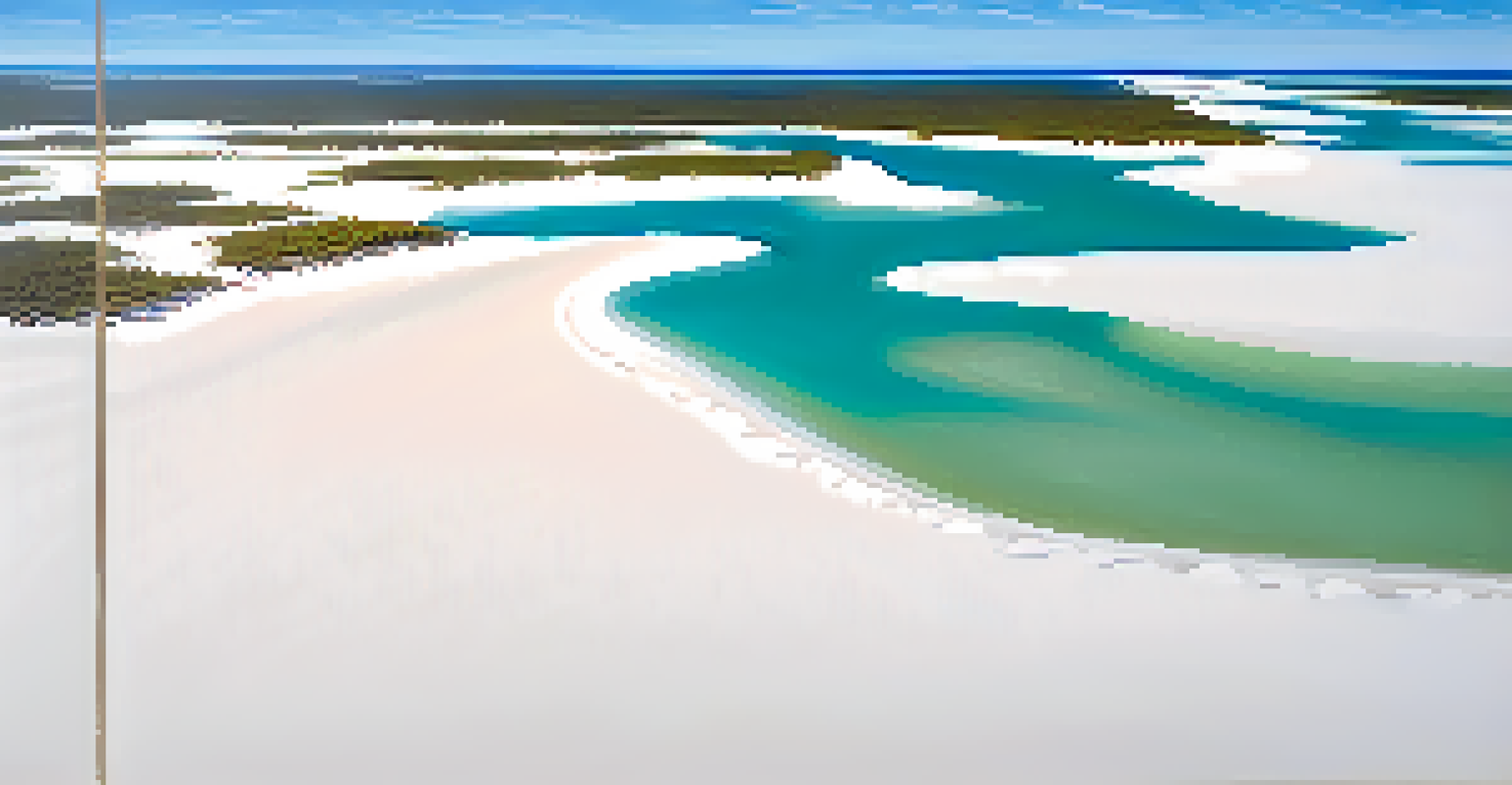 Aerial view of Lençóis Maranhenses National Park, featuring white sand dunes and clear lagoons under a blue sky.