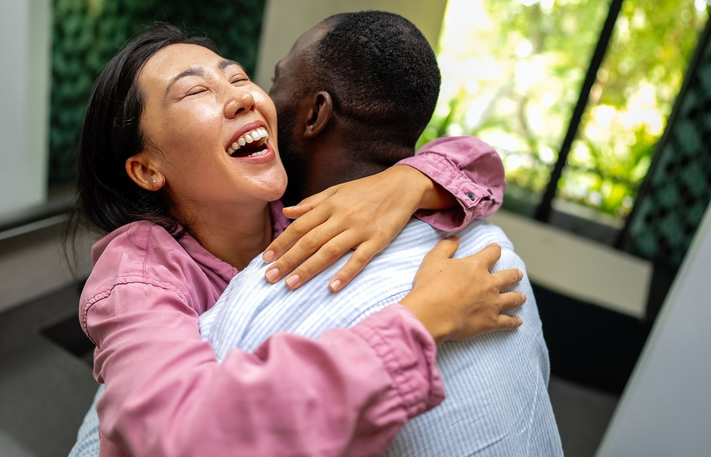Two people sharing a joyful embrace