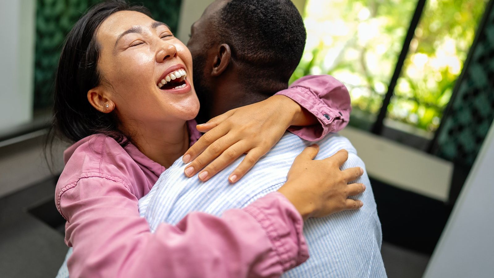 Two people sharing a joyful embrace