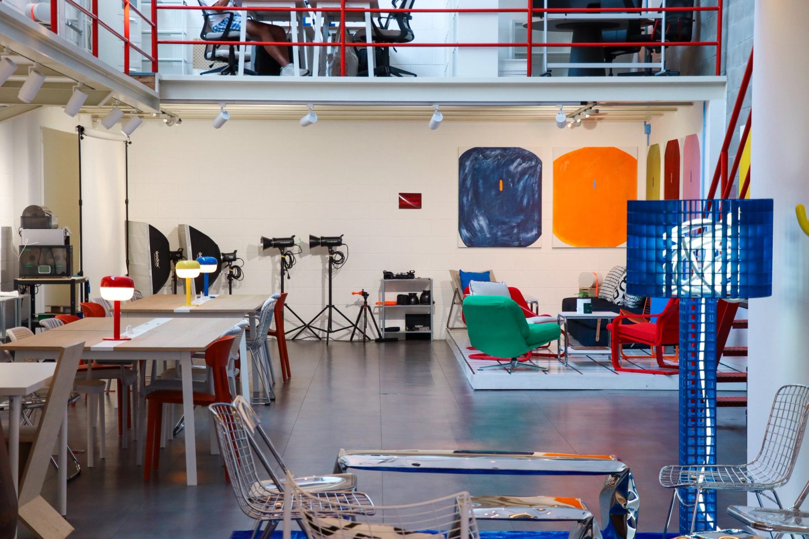creative coworking space interior at Spazio ivy in Milan with shared desks, editorial lounge areas, contemporary artwork, and industrial architecture.