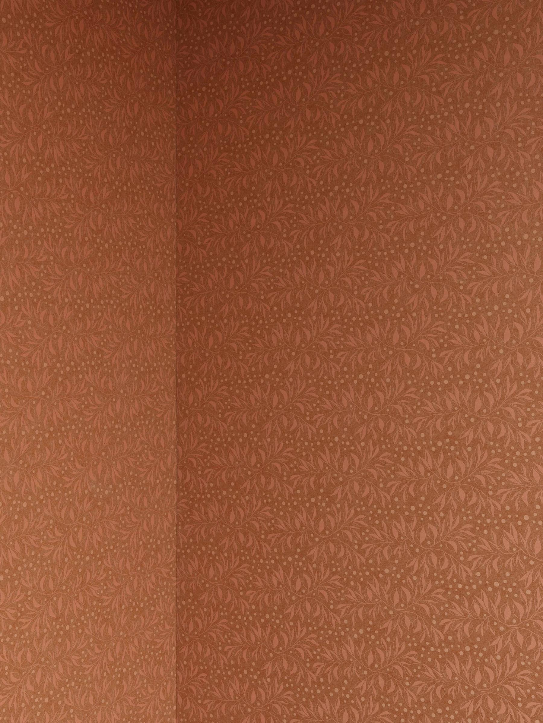 Close up of wallpaper detailing in warm amber tones