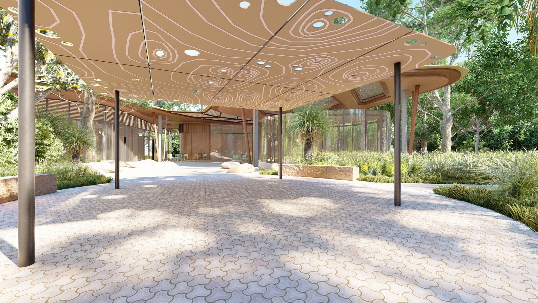 Patterned pavement under a designed canopy structure held up by black poles, leading towards a curved timber building, surrounded by gardens and trees.