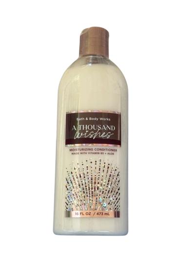 Acondicionador hidratante Bath &Body Works A Thousand Wishes con aroma a Prosecco rosado, peonías silvestres y cassis dorado