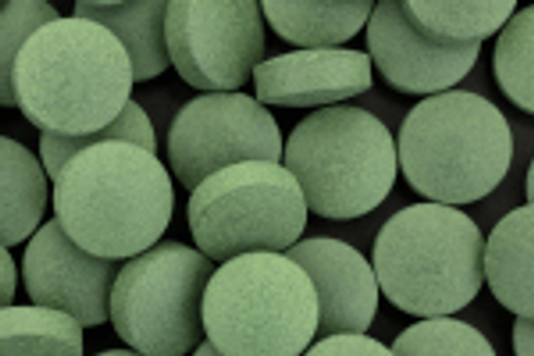 A close-up of round tablets.
