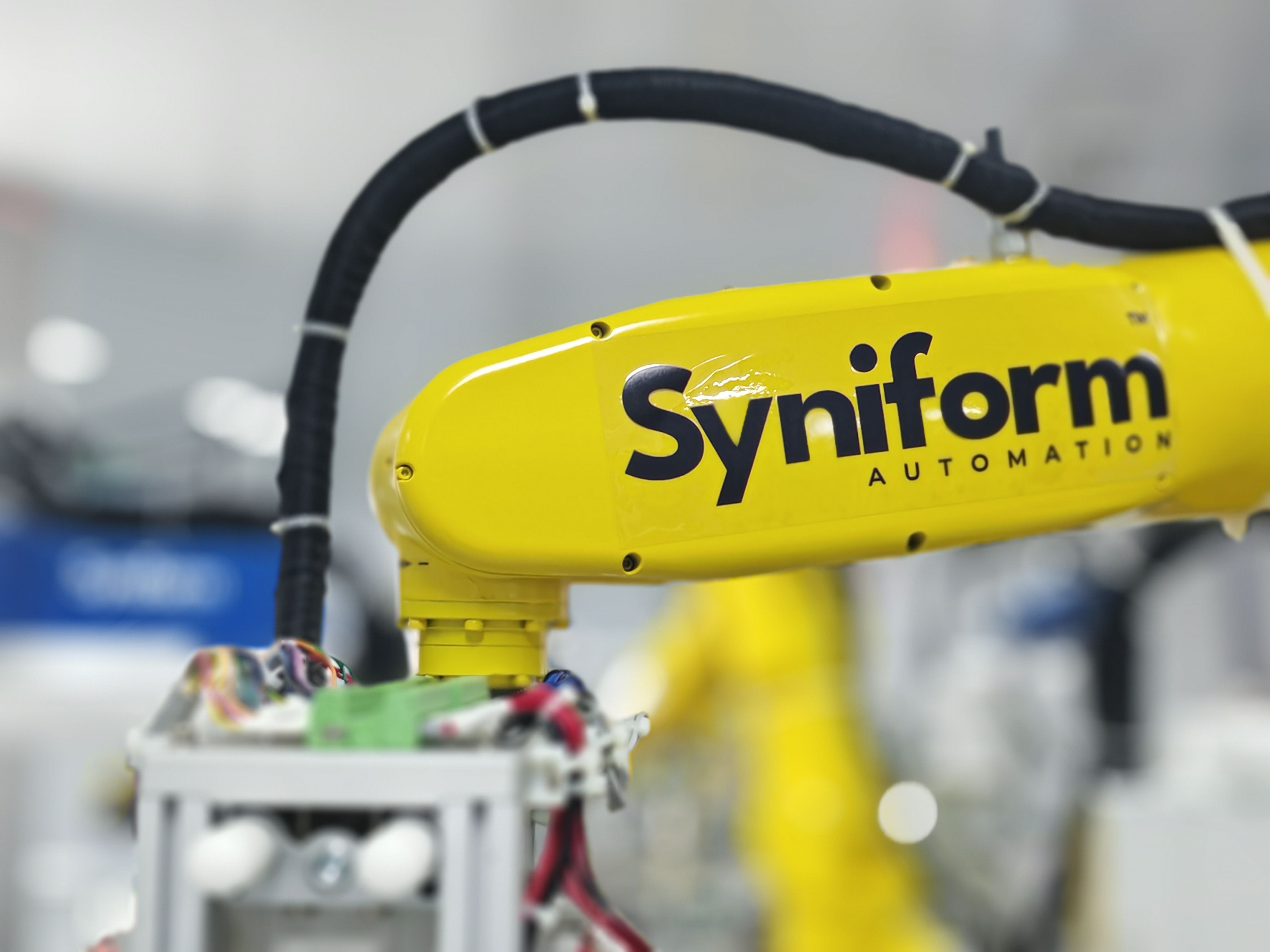 Automated apparel production equipment supporting local manufacturing capacity