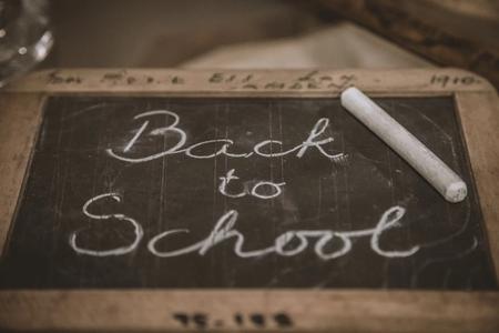 chalk board with writing "Back to School" in cursive