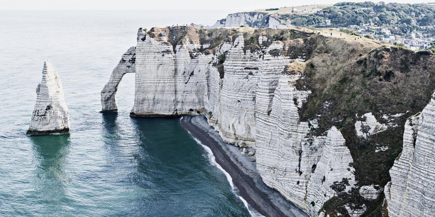 Dramatic white chalk cliffs of the Alabaster Coast at Étretat in Normandy
