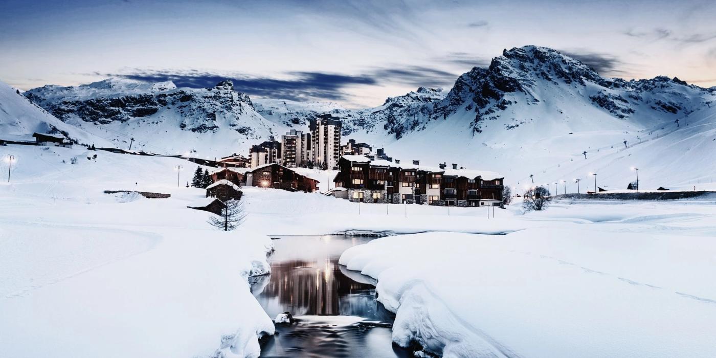 View of luxury resort buildings in a French Alpine valley Tignes