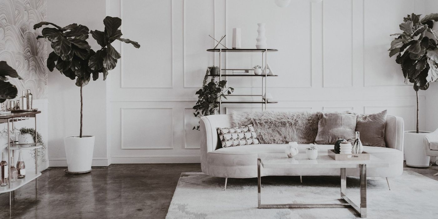 Elegant Parisian apartment interior featuring exposed stone walls and herringbone parquet flooring