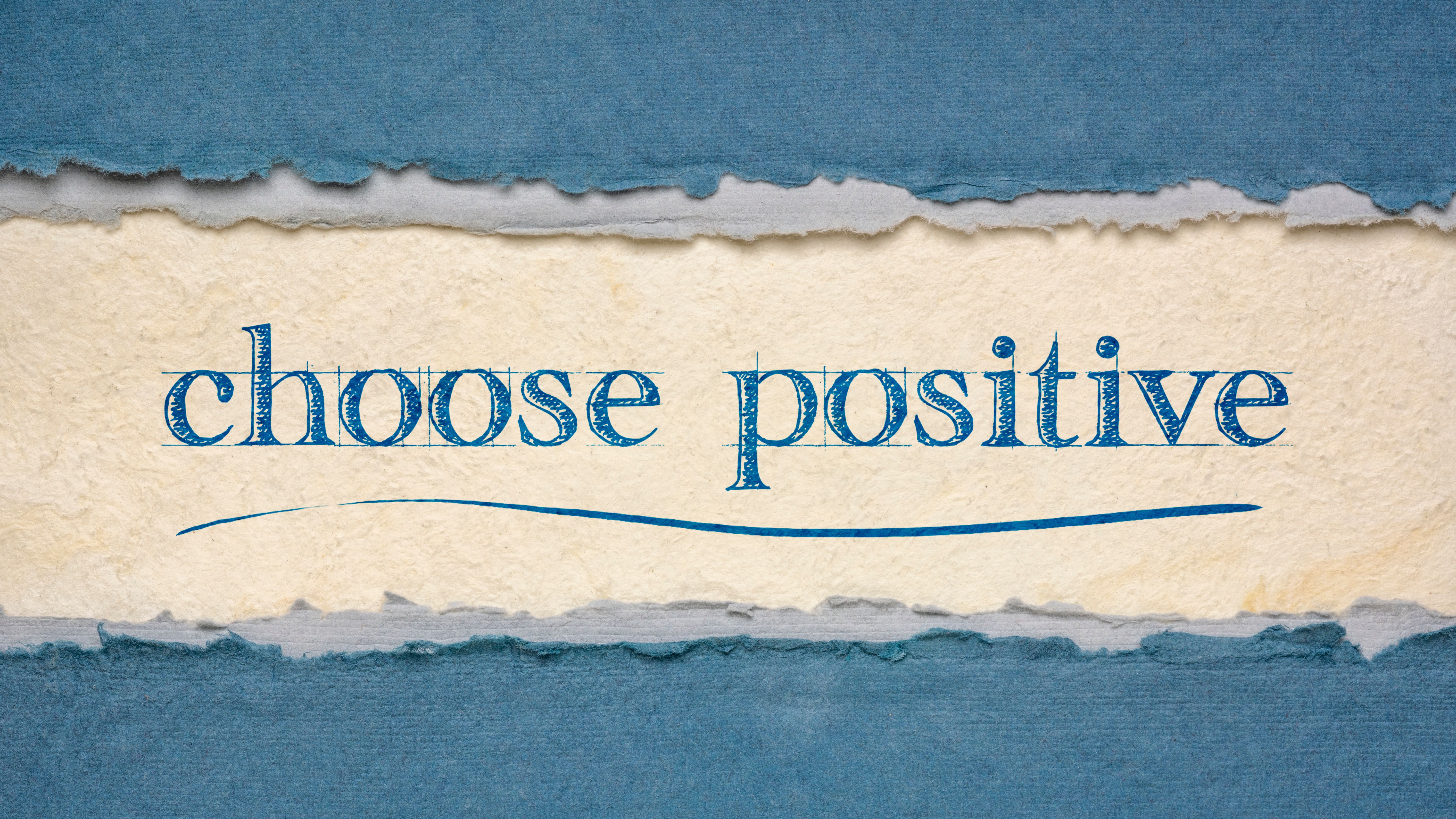 "Choose positive" in blue on textured paper, framed by blue and gray torn paper edges. Motivational phrase.