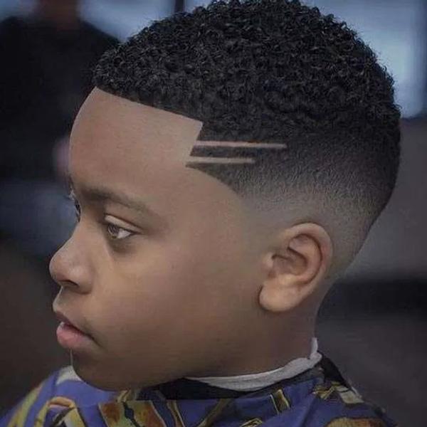 A child's fade with a lightning bolt shaved into the side