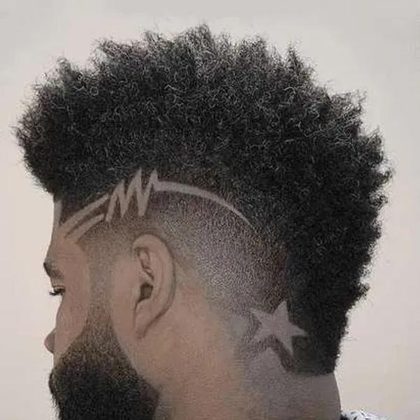 A star and lightning pattern shaved into the side of an afro