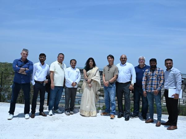 The team on the viewing area overlooking the dam.