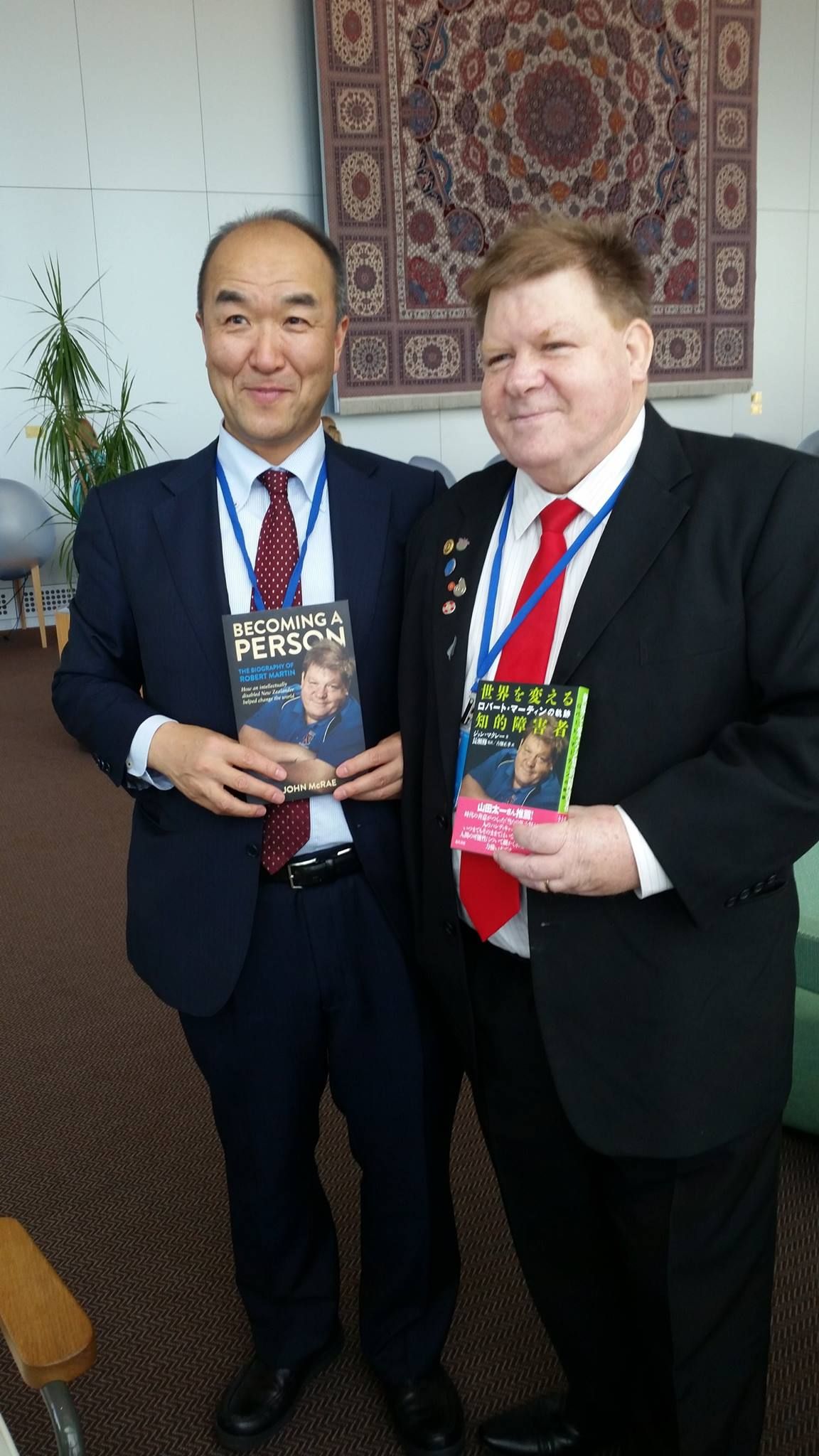 Robert Martin with Nagase Osamu holding each others versions of the book English and Japanese.