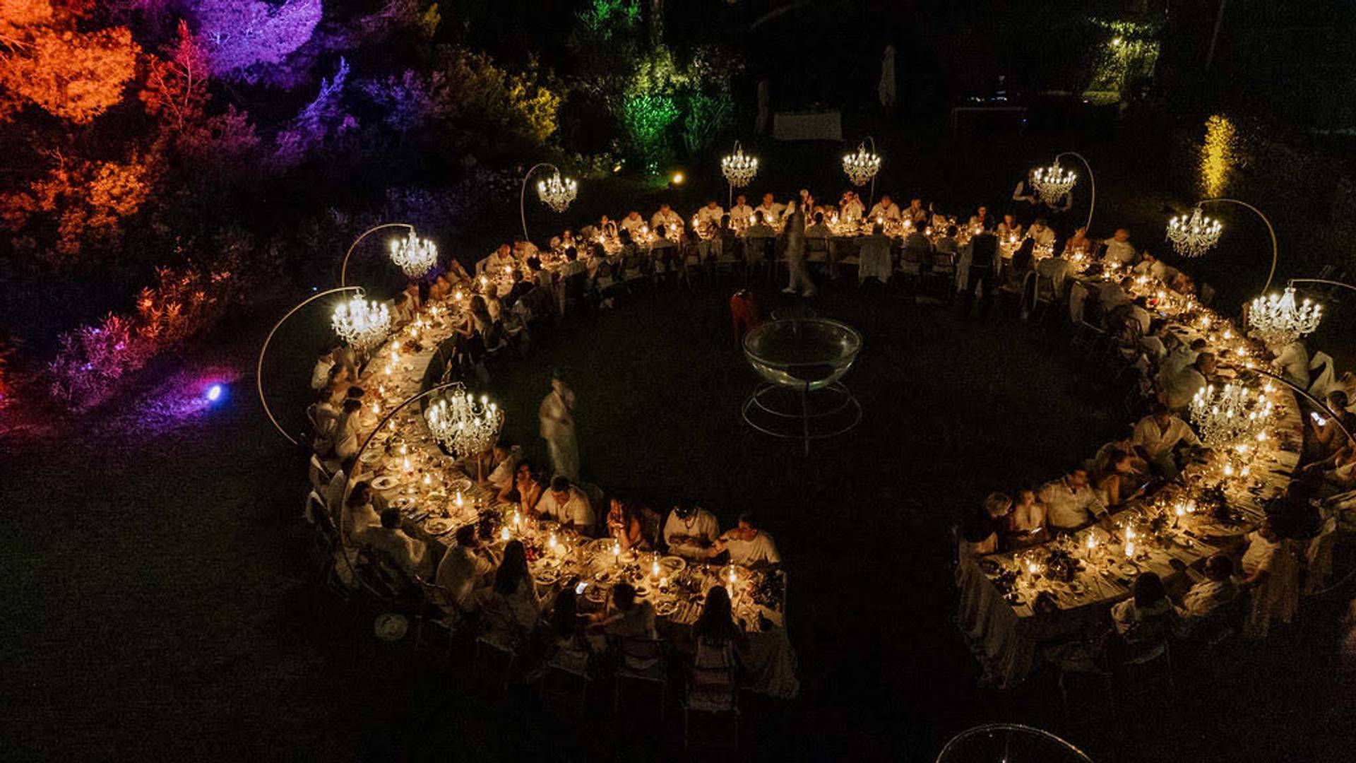 Luxury event in Ibiza with dramatic lighting and ocean views