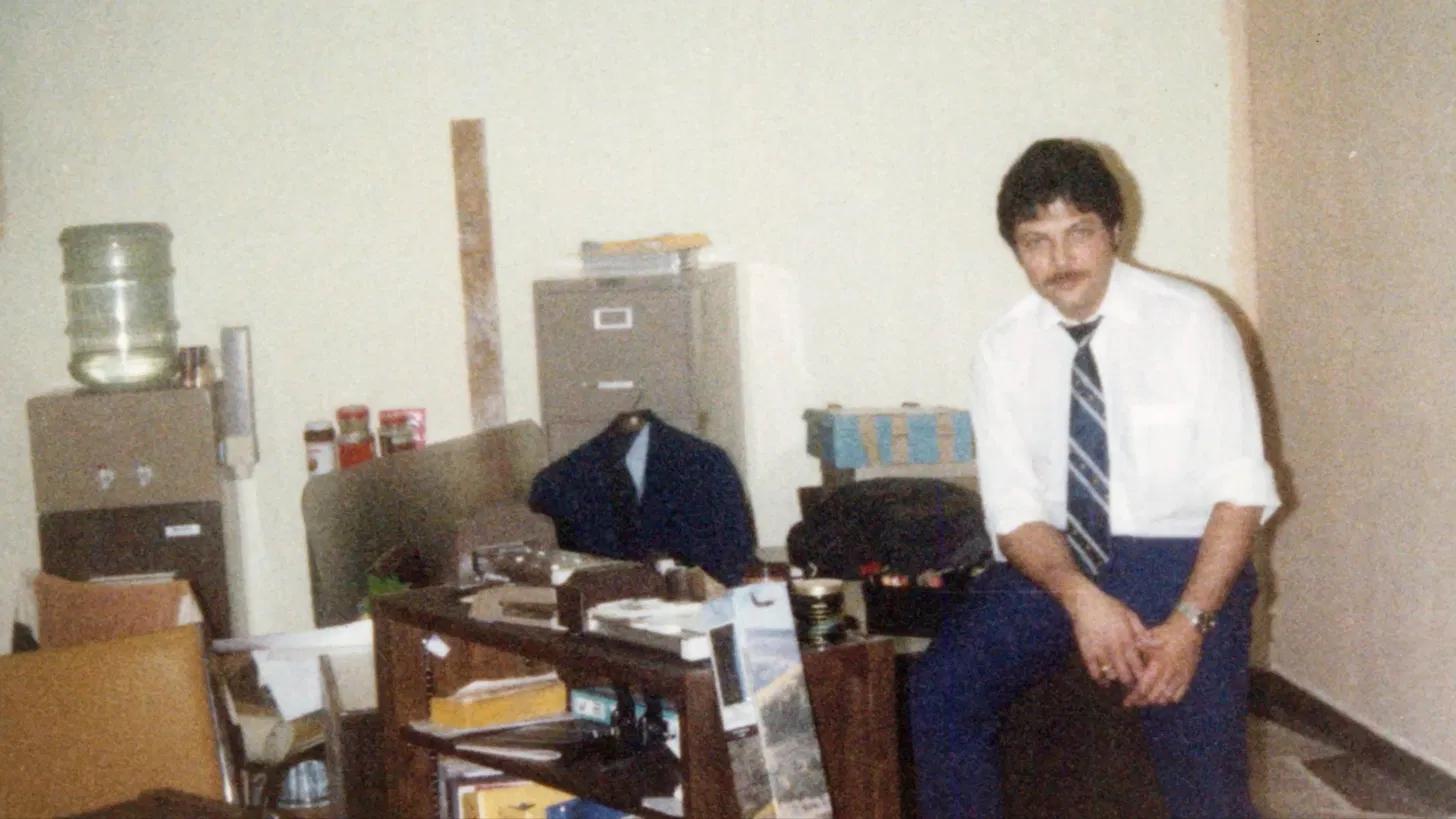 Erik Salazar's father in his travel agency office in Miami