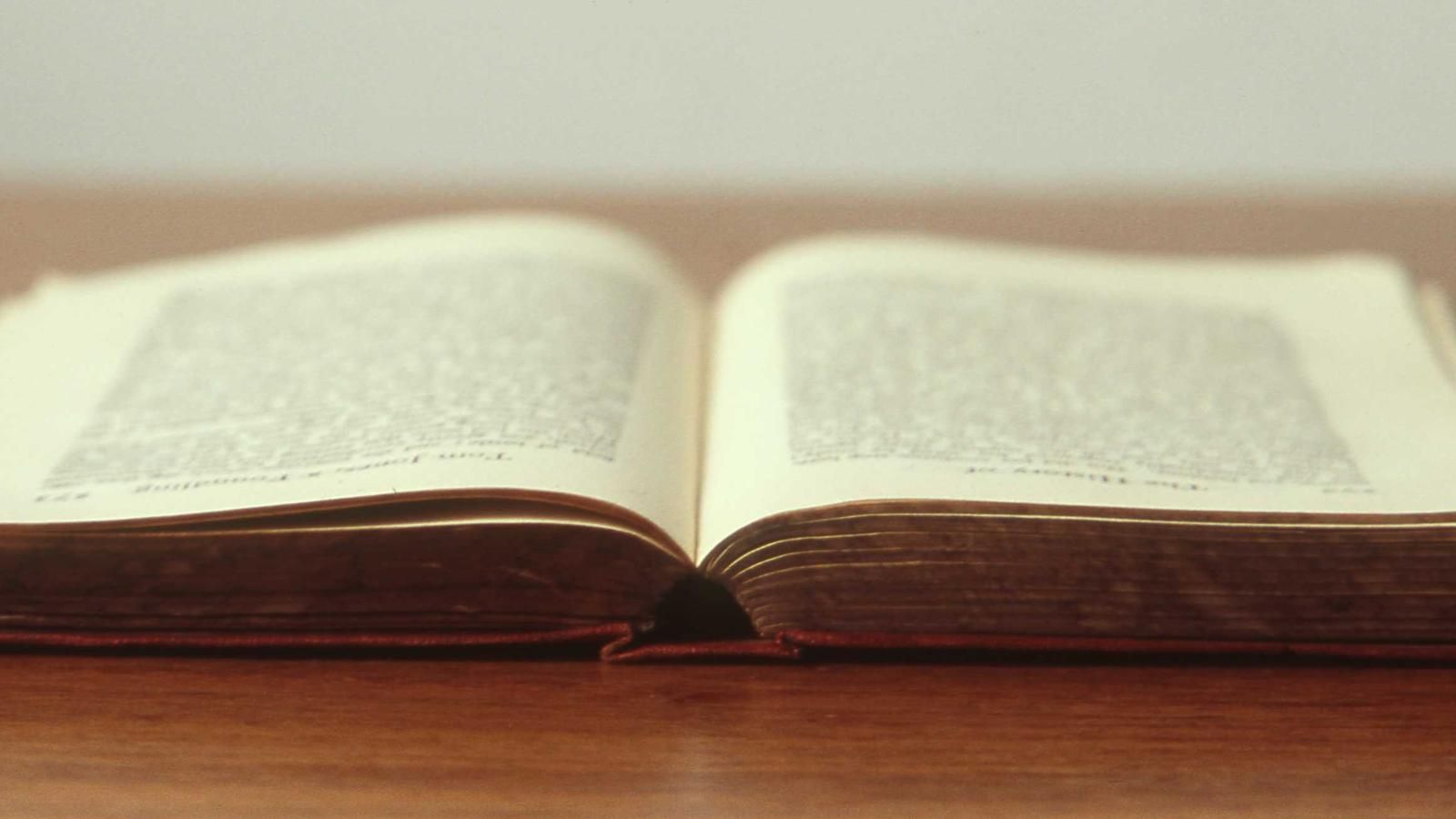 Open notebook with a pen on top
