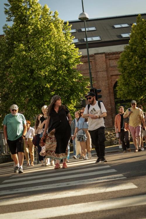 a group of people crossing the street