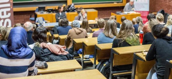 A glass of coins symbolizing the SAIH tenners.