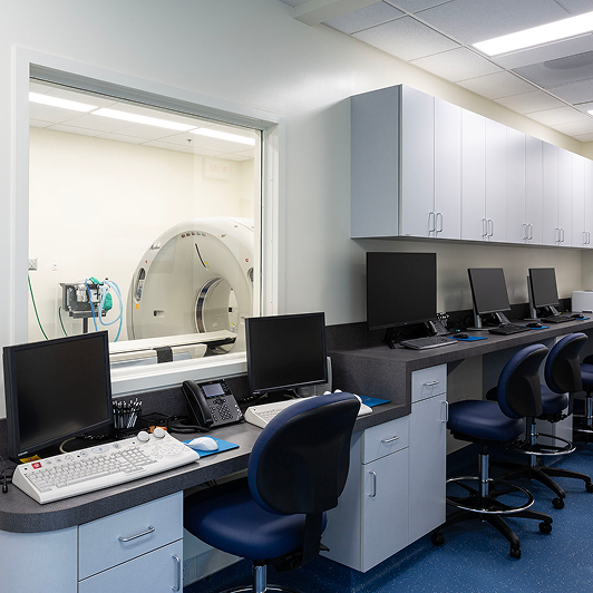 An MRI imaging center with a row of computer monitors.