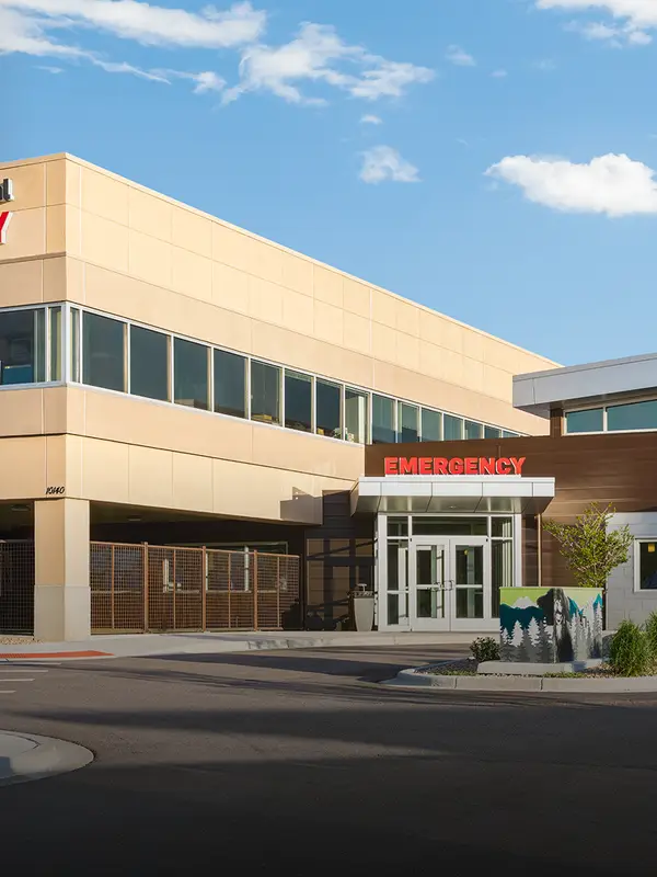 Exterior of Wheat Ridge Animal Hospital with emergency entrance and signage.