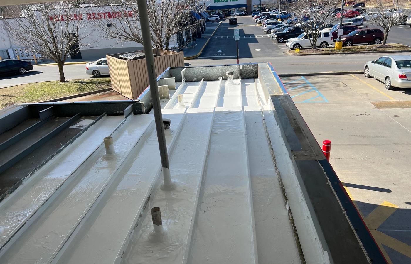 Small metal panel roof restored with a white coating in Johnson City