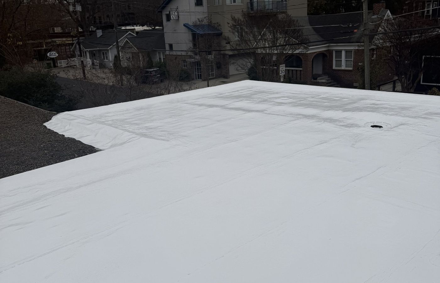 Modified bitumen roof restored with a white silicone coating in Atlanta