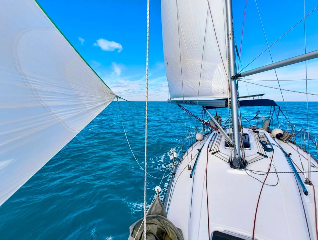 Buri's spinnaker flying over open water
