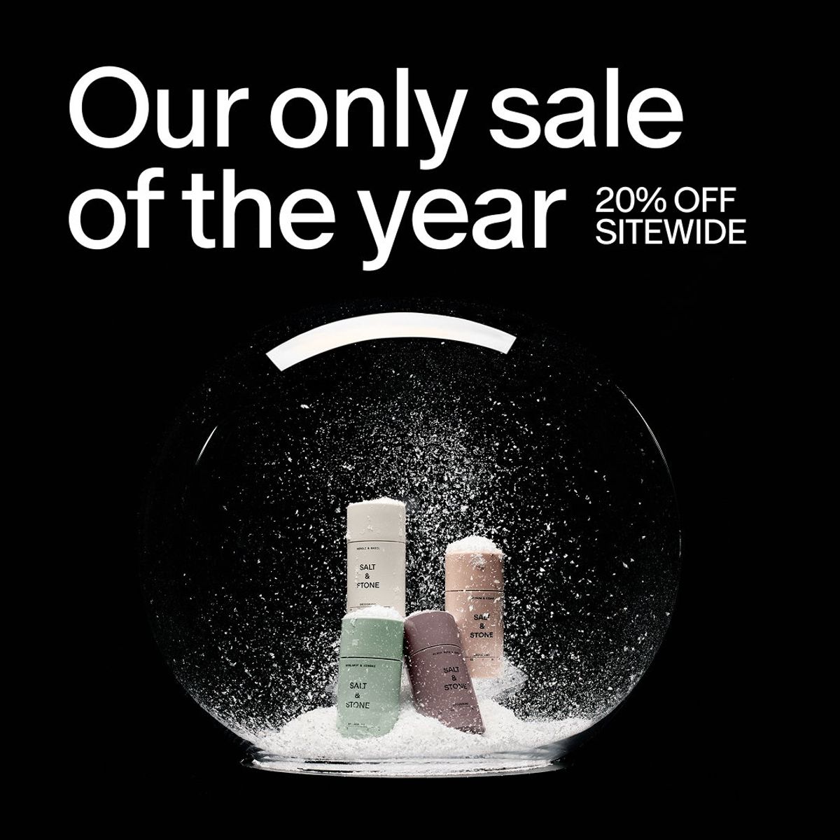 Salt & Stone holiday sale ad with product bottles inside a snow globe and a 20 percent off sitewide offer.