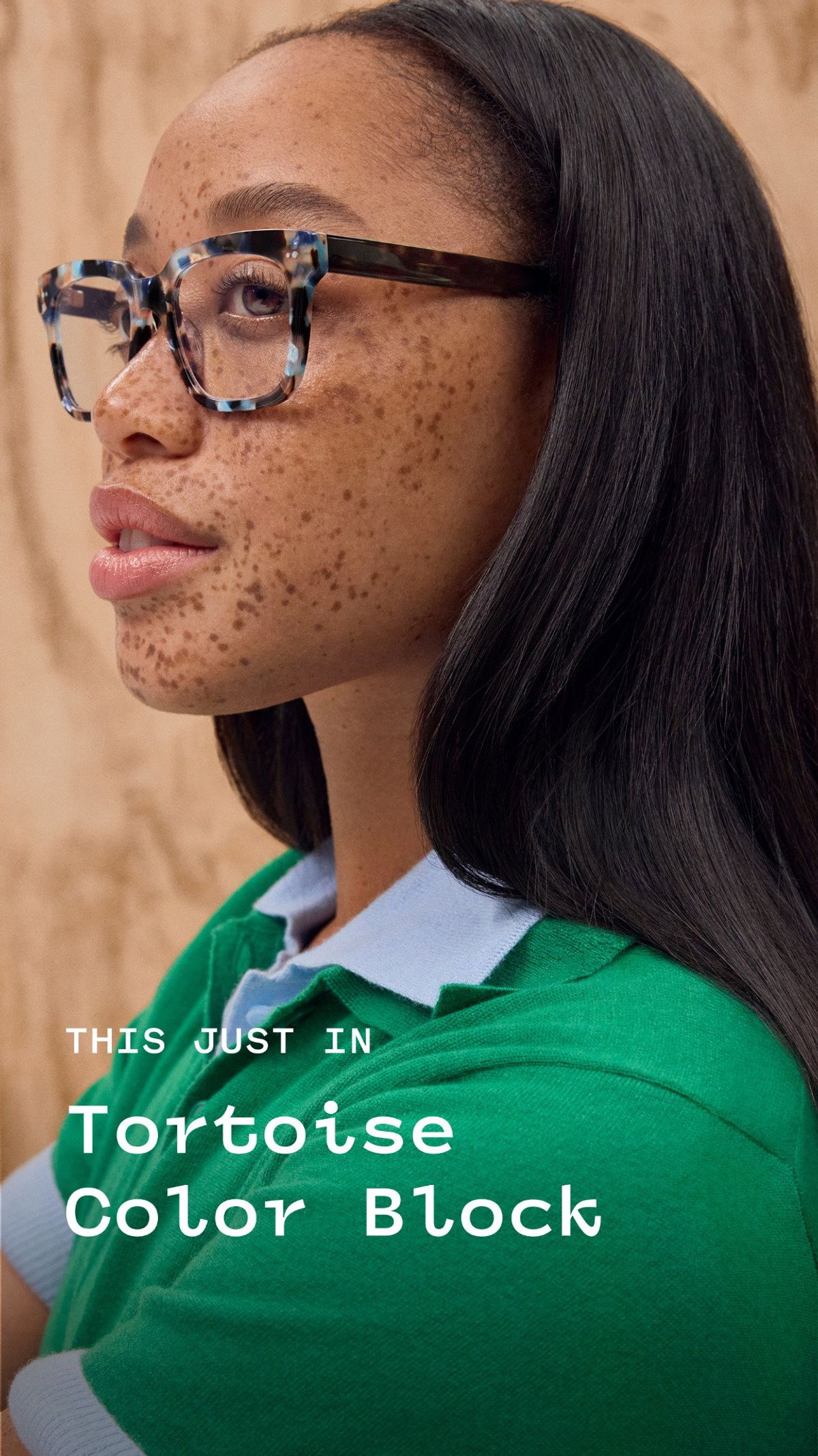 Warby Parker ad showing tortoise color-block frames worn on a face.