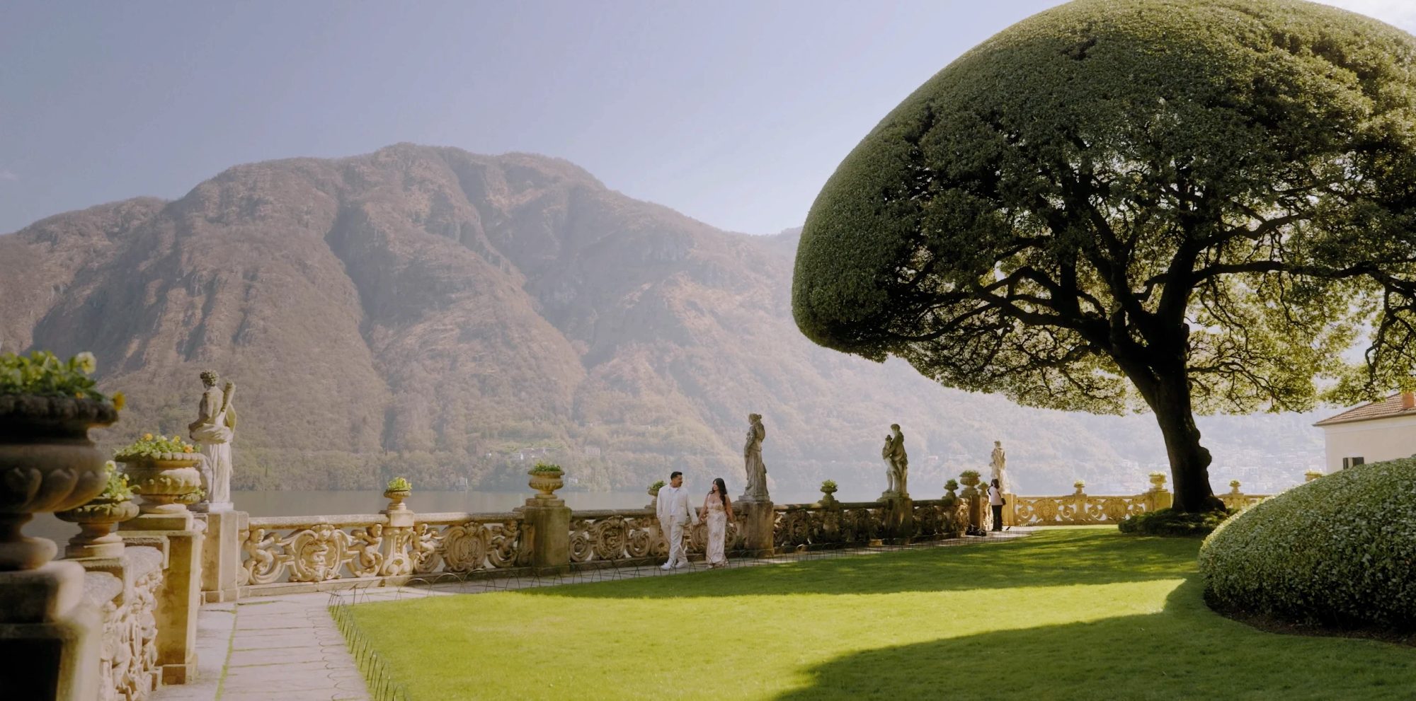 Couple walking on the terrace of Villa del Balbianello, Lake Como