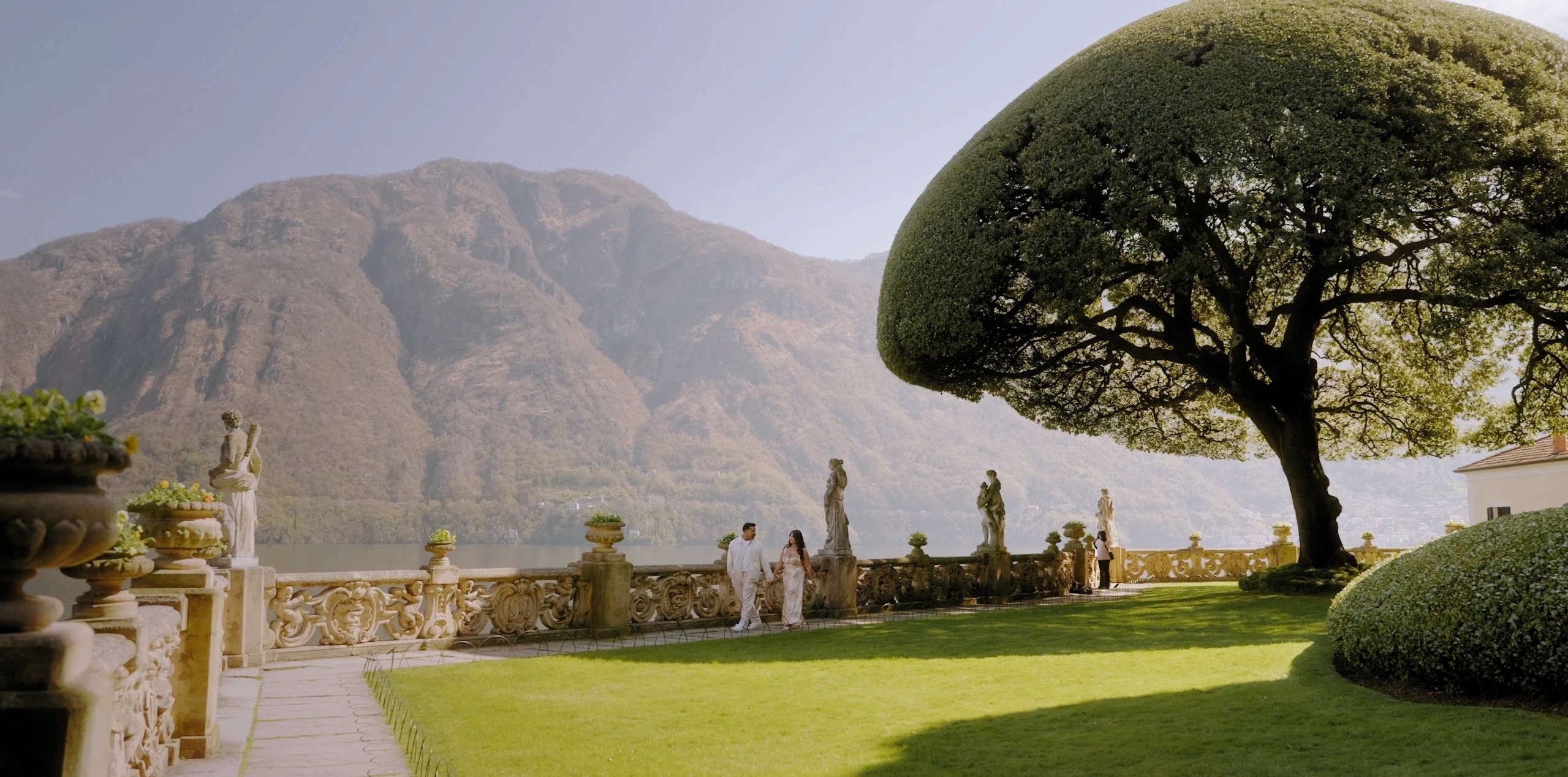 Couple walking on the terrace of Villa del Balbianello, Lake Como