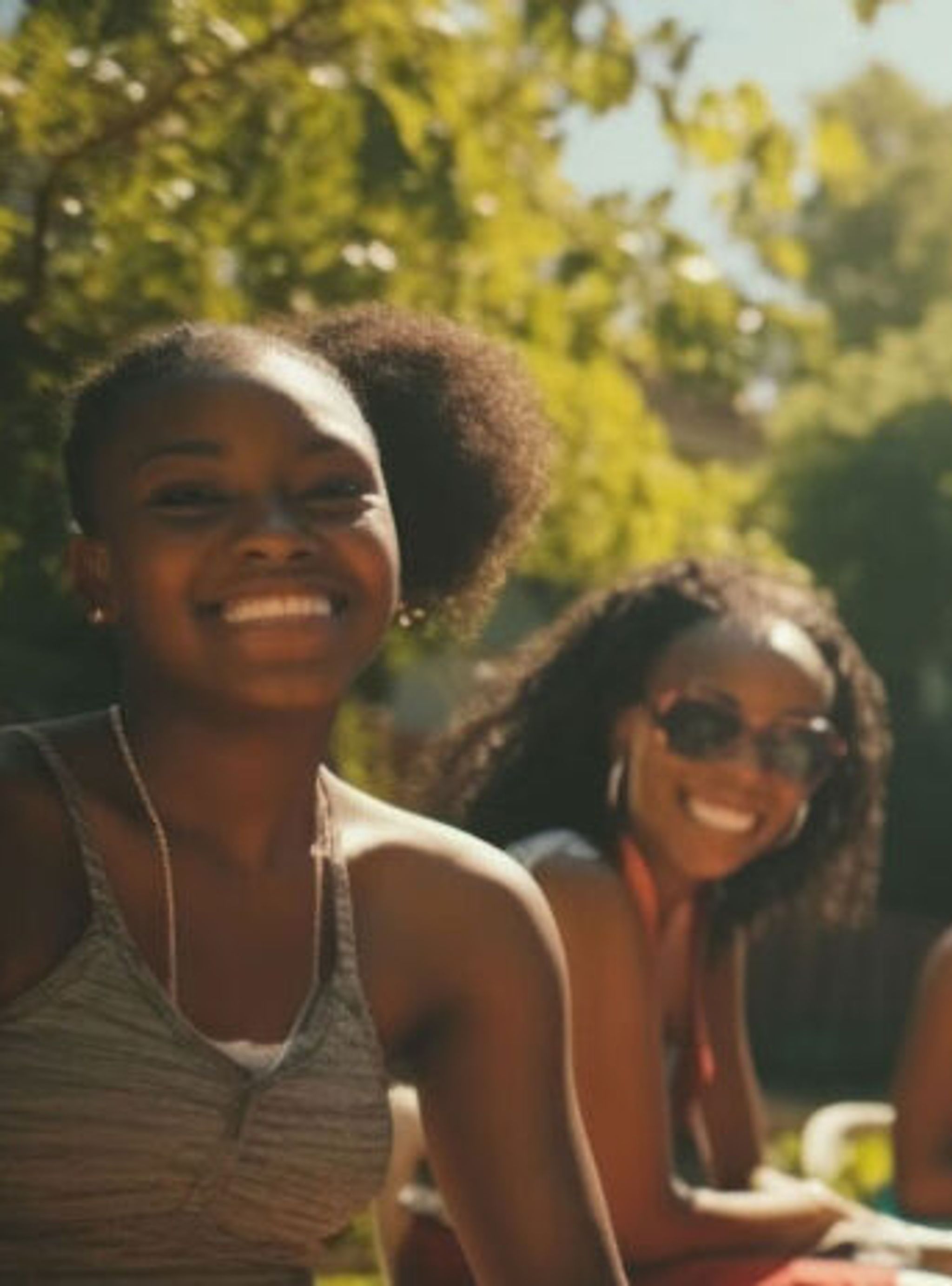 Two people smiling in the sunshine
