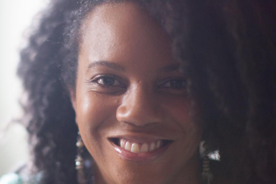 Smiling black woman wearing earrings