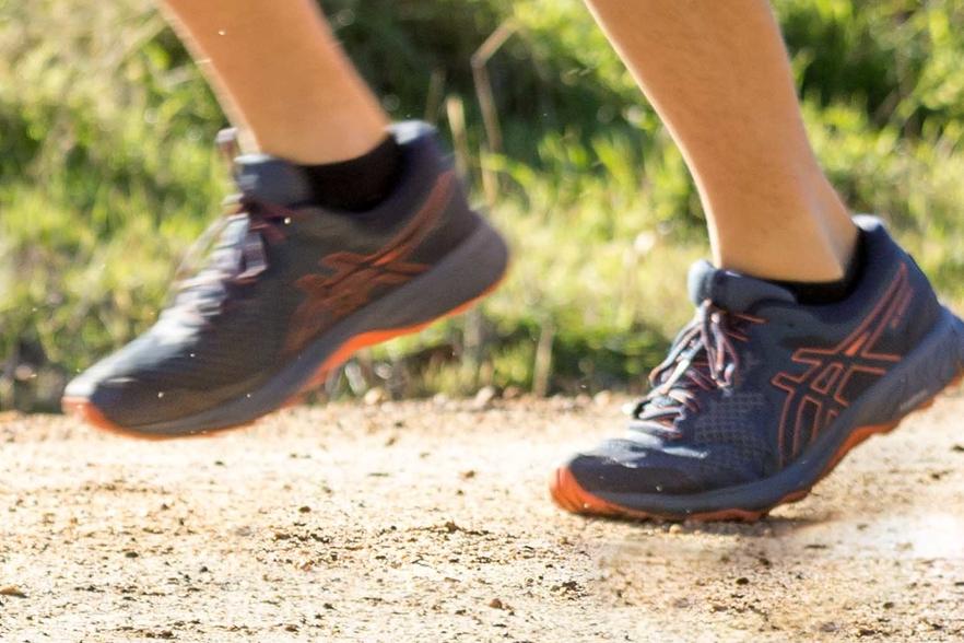 Man running on the road in a rural area