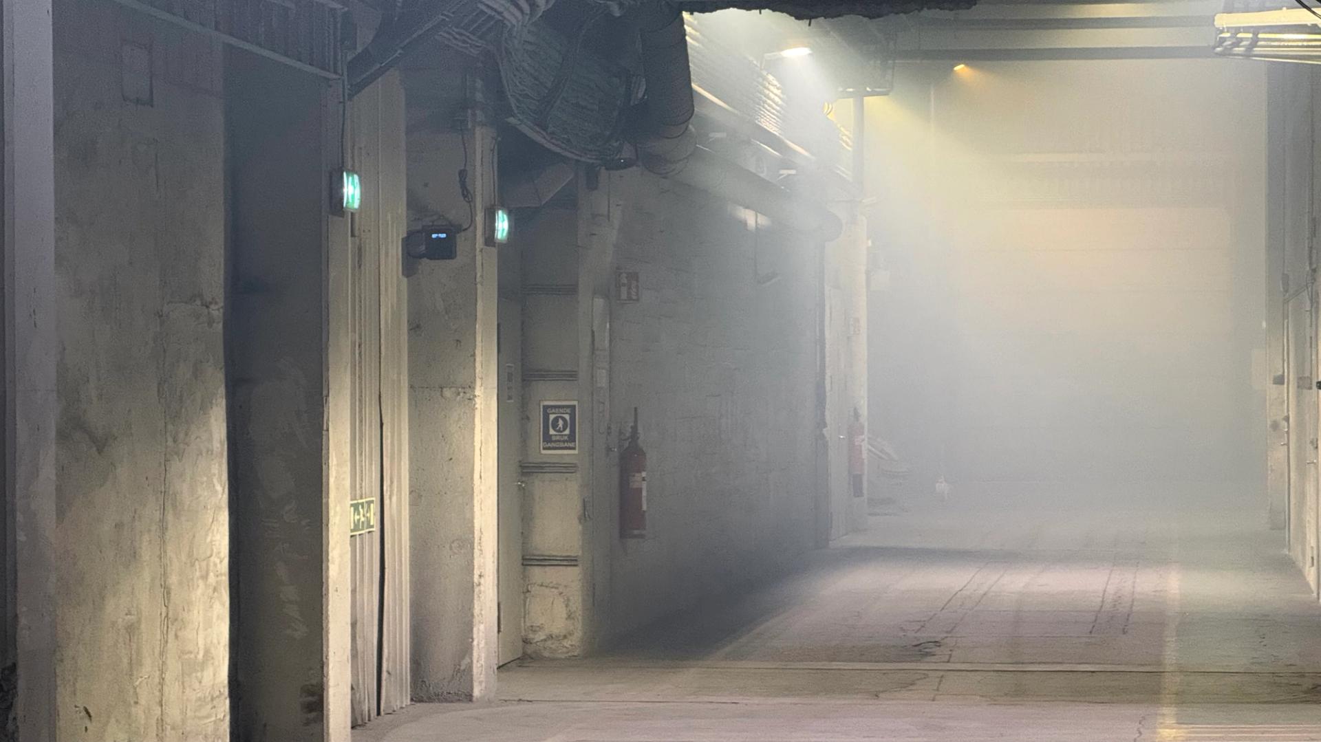 Indoor factory full of airborne dust