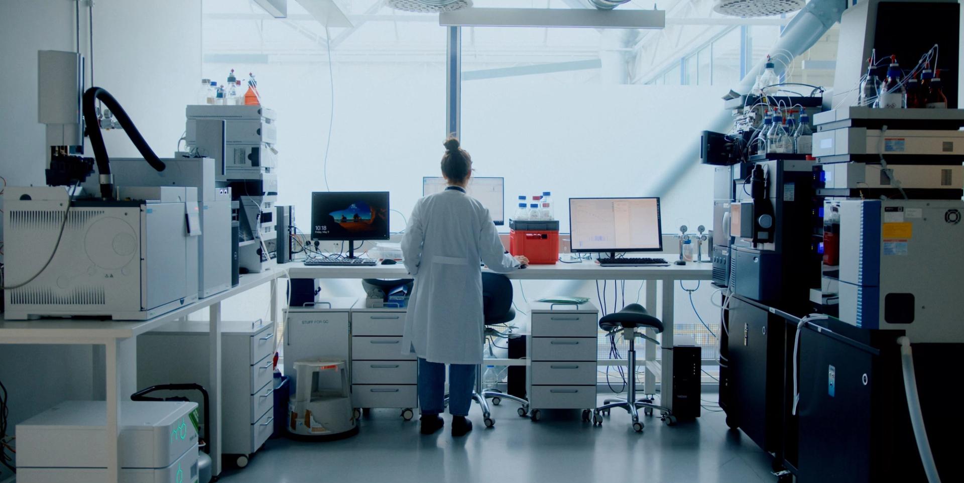 Female lab worker looking at test results