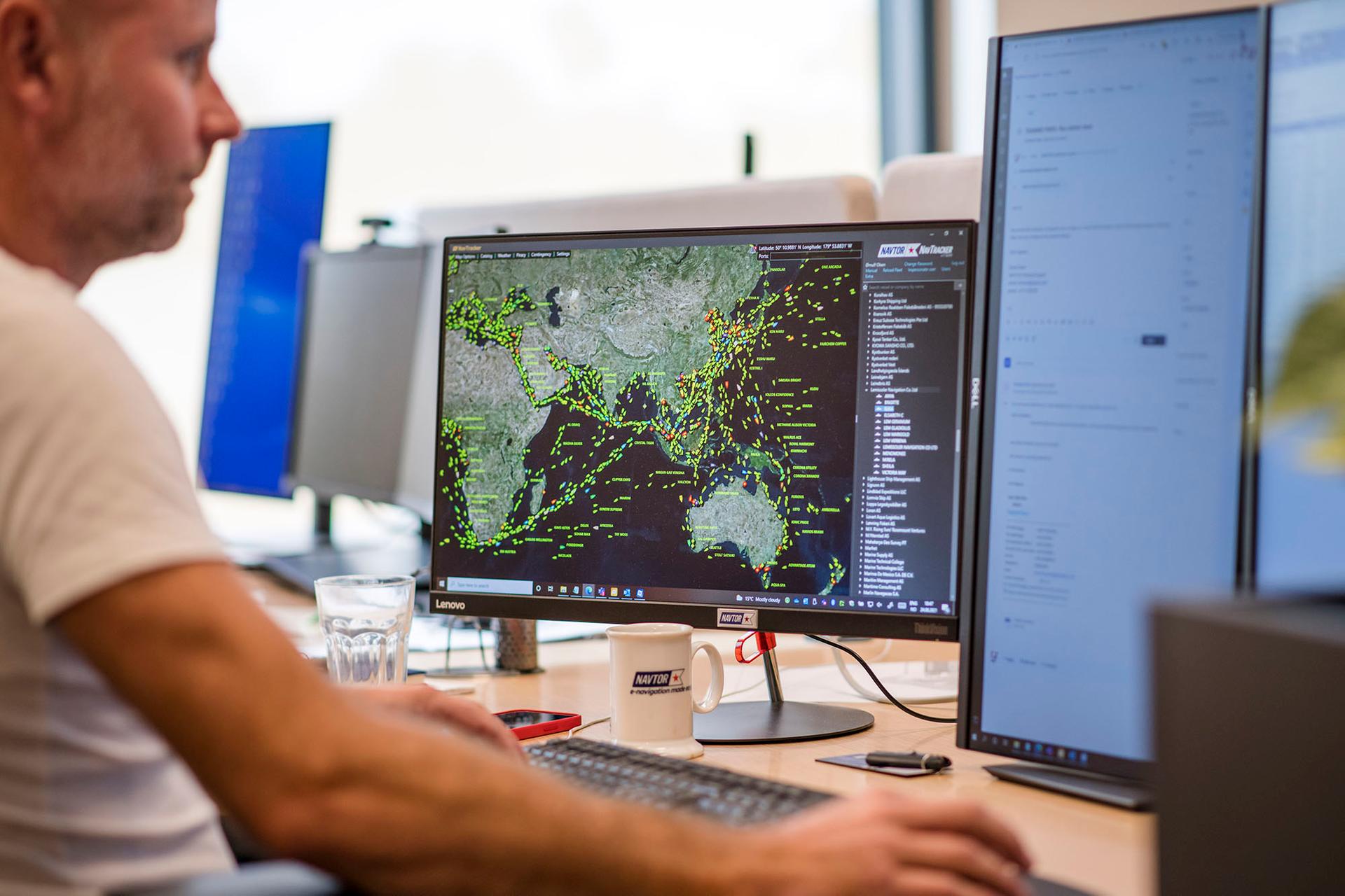 Man using NavTracker software on a computer screen